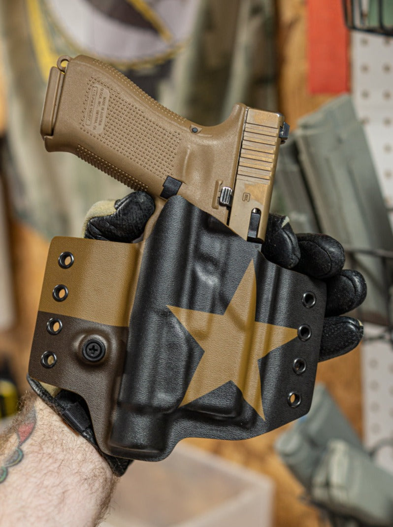 Outside the Waistband OWB Kydex Holster in our Coyote Brown infused Kydex. Shown for a Glock 19 with Streamlight TLR-1