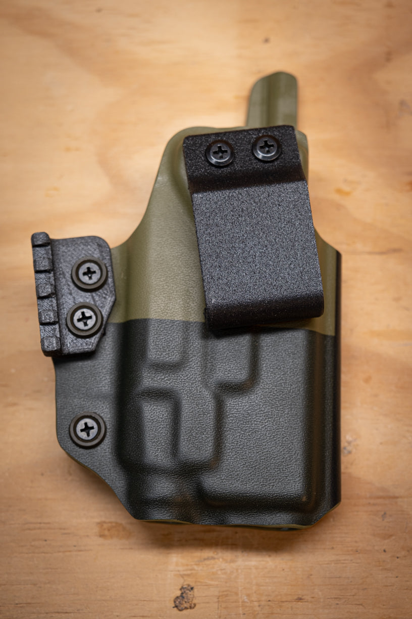 IWB Inside the Waistband Glock 19 with Streamlight TLR-7 light bearing kydex Holster wrapped in OD Green Texas flag.