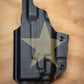 IWB Inside the Waistband Glock 19 with Streamlight TLR-7 light bearing kydex Holster wrapped in OD Green Texas flag showing the side with the Lone Star