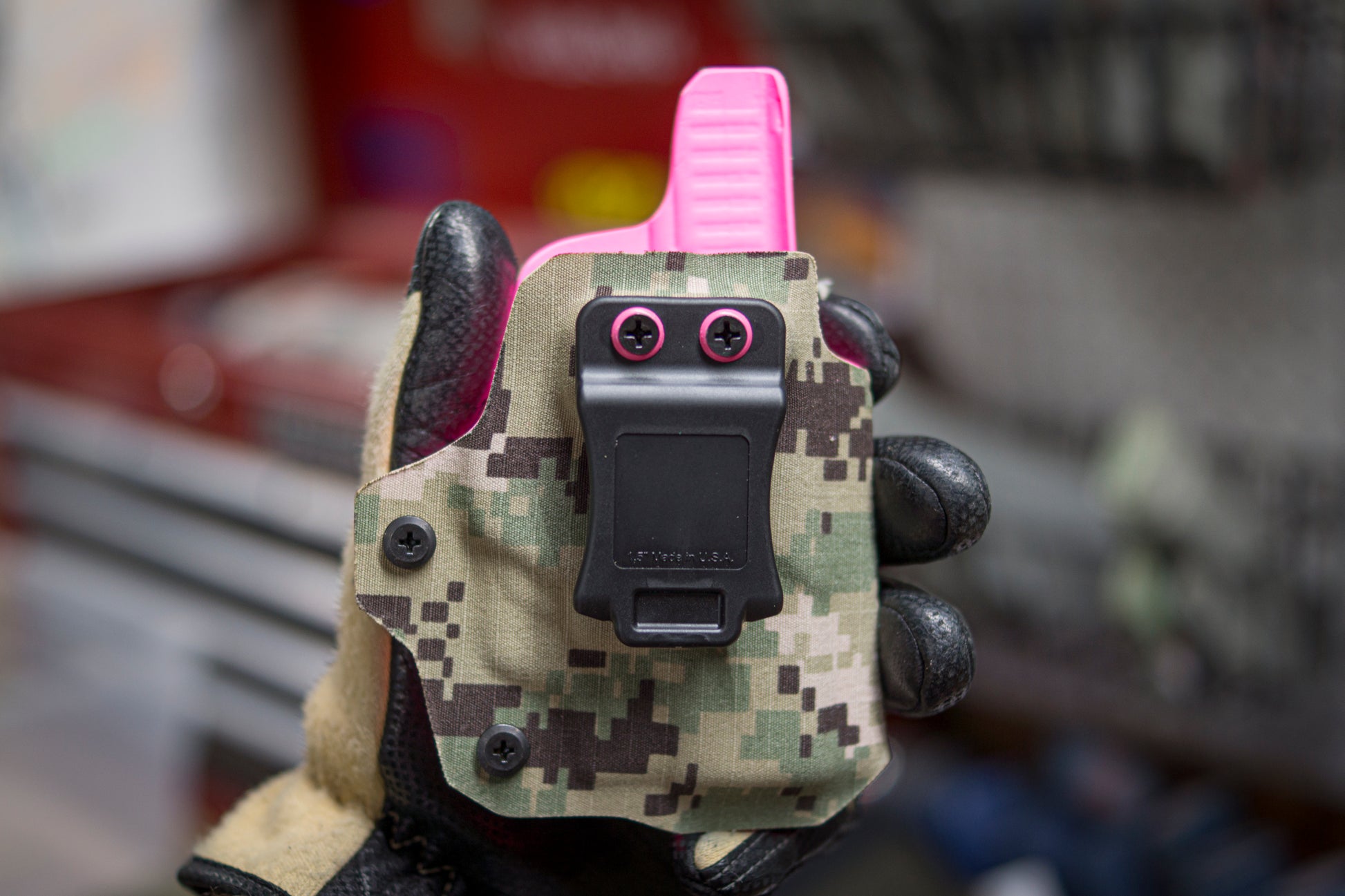IWB Holster with the customers uniform adhered to Neon Pink Kydex.