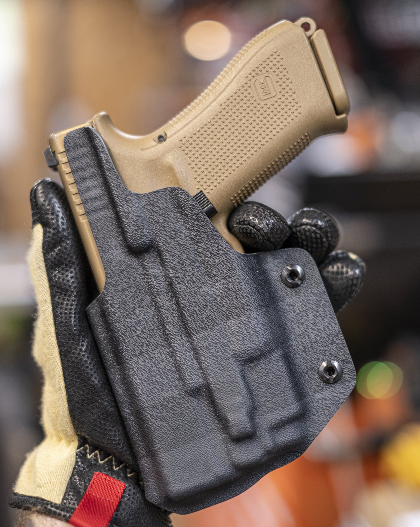 IWB Light Bearing Holster for a Glock with an Olight Baldr Mini in Black on Black American Flag infused Kydex.