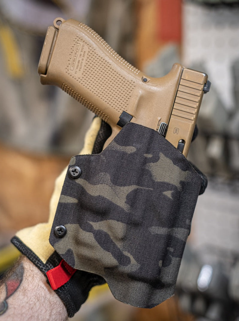 Outside the Waistband Fold-over Kydex holster in Multicam Black fabric covered Kydex shown here for a Glock 19 with Olight Baldr Mini.