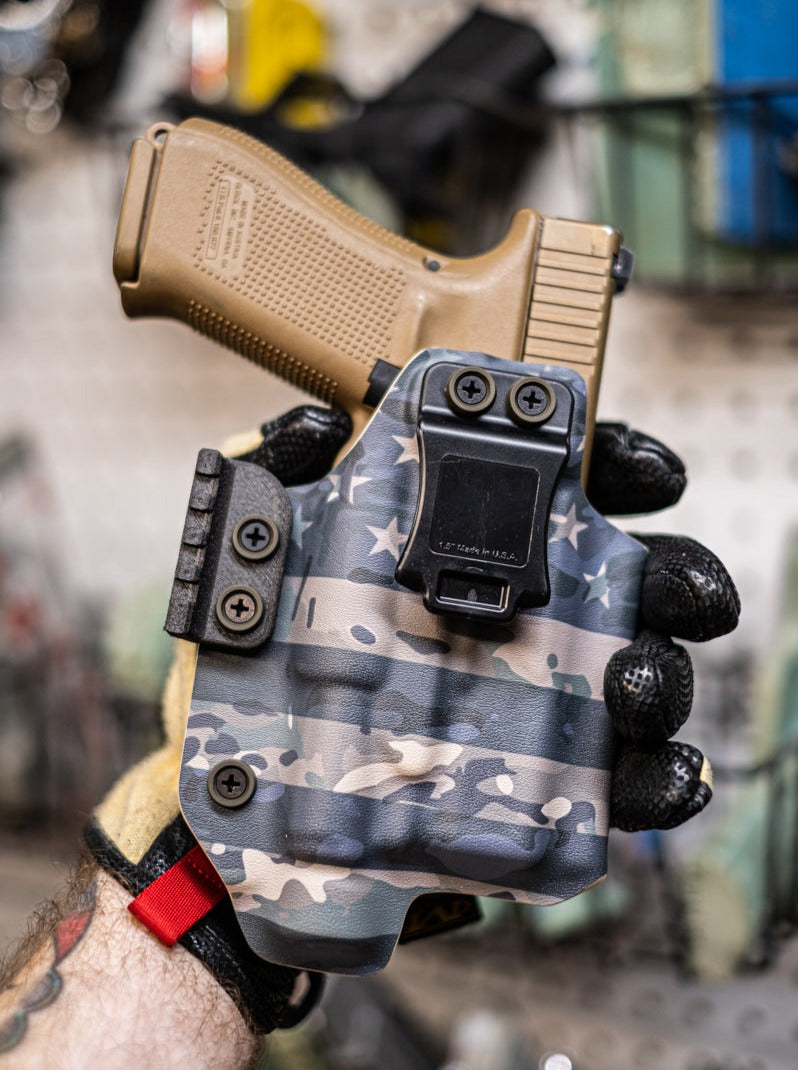 Inside the Waistband Kydex holster for a Glock 19 with Olight PL-Pro.  American flag Camo print.