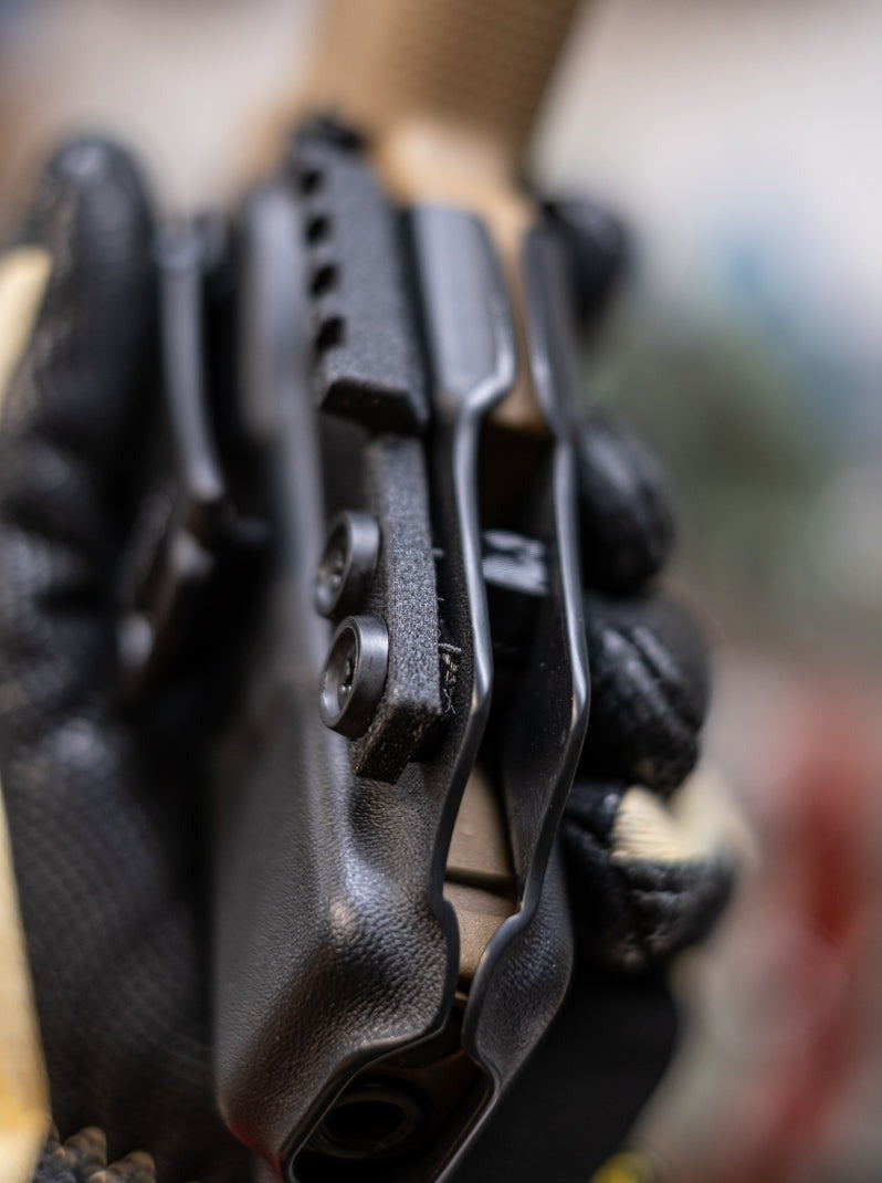 Close of shot of the hand sanded edges on our Kydex Holsters.  Shown here is a close up of the edges to highlight the smoothness of the edge finish.