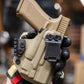 Inside the Waistband Kydex Holster in FDE Carbon Fiber.  Shown here for a Glock 19 with Olight Baldr Mini light.