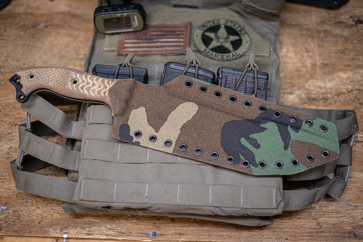 Kydex knife sheath in Woodland Camo fabric covered Kydex.