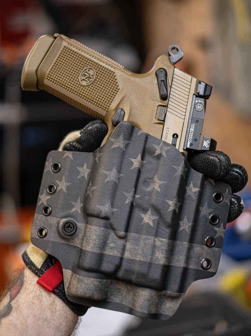 Outside the Waistband Kydex Holster for an FN FNX-45 Tactical with Streamlight TLR-1 light.