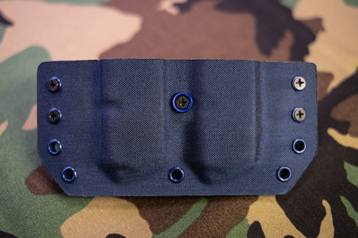 Outside the Waistband Double Magazine Carrier covered in Blue Denim Cordura Fabric.