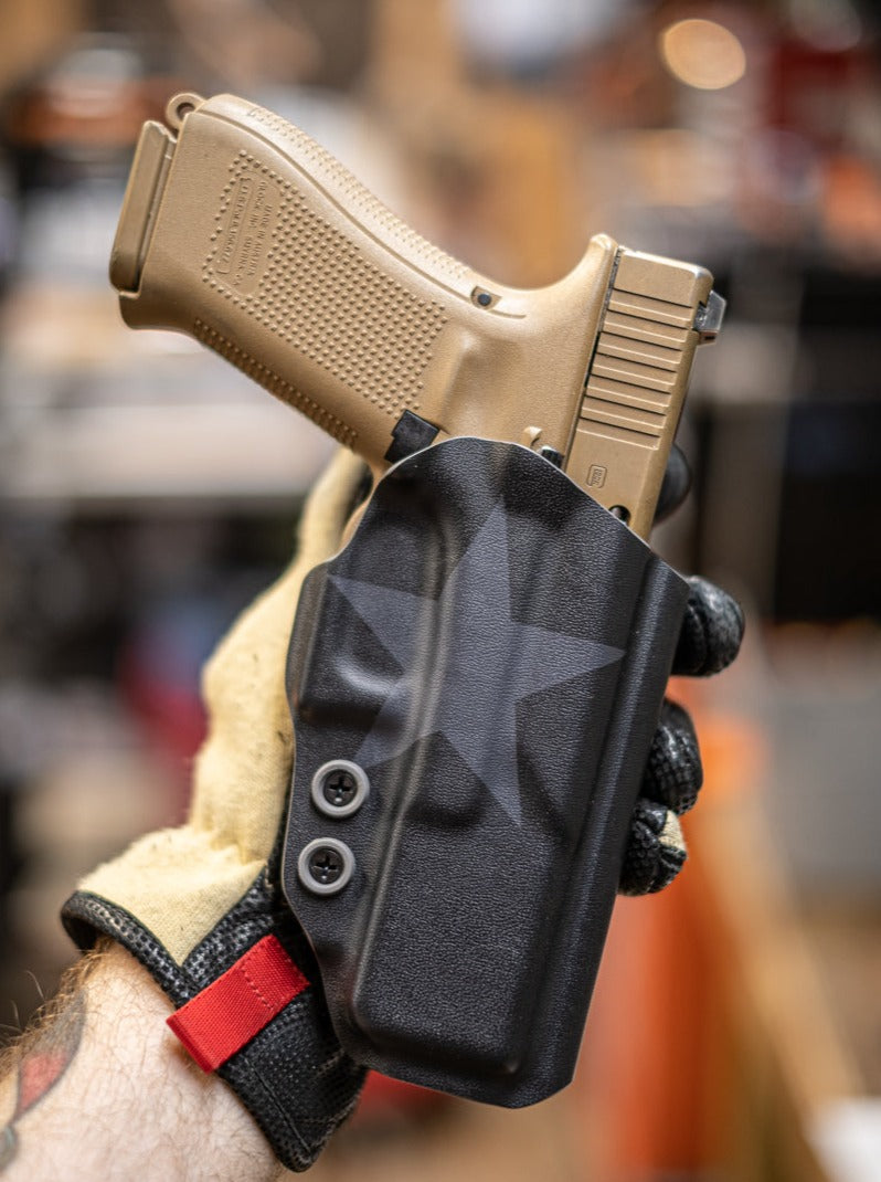 Outside the Waistband fold over Kydex holster in our Black on Black Texas flag.  Here is an example of the front of the holster.