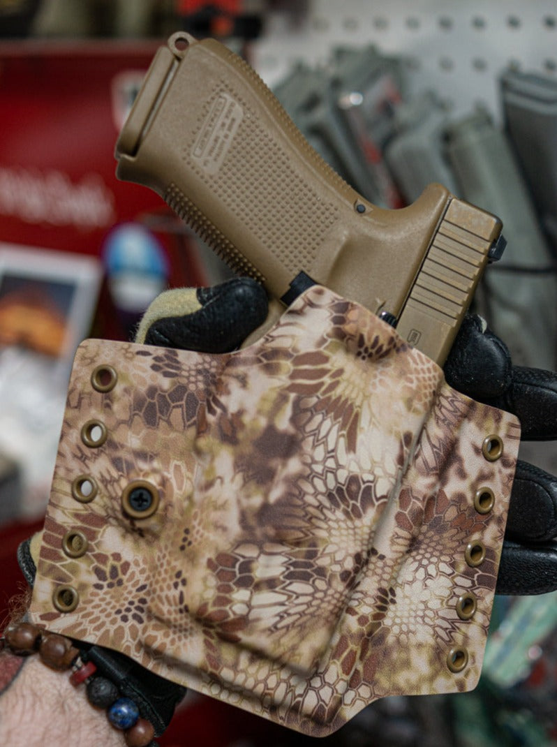 Outside the Waistband Kydex Holster for a Glock 19 with Inforce APL-C in Kryptek Highlander infused Kydex.