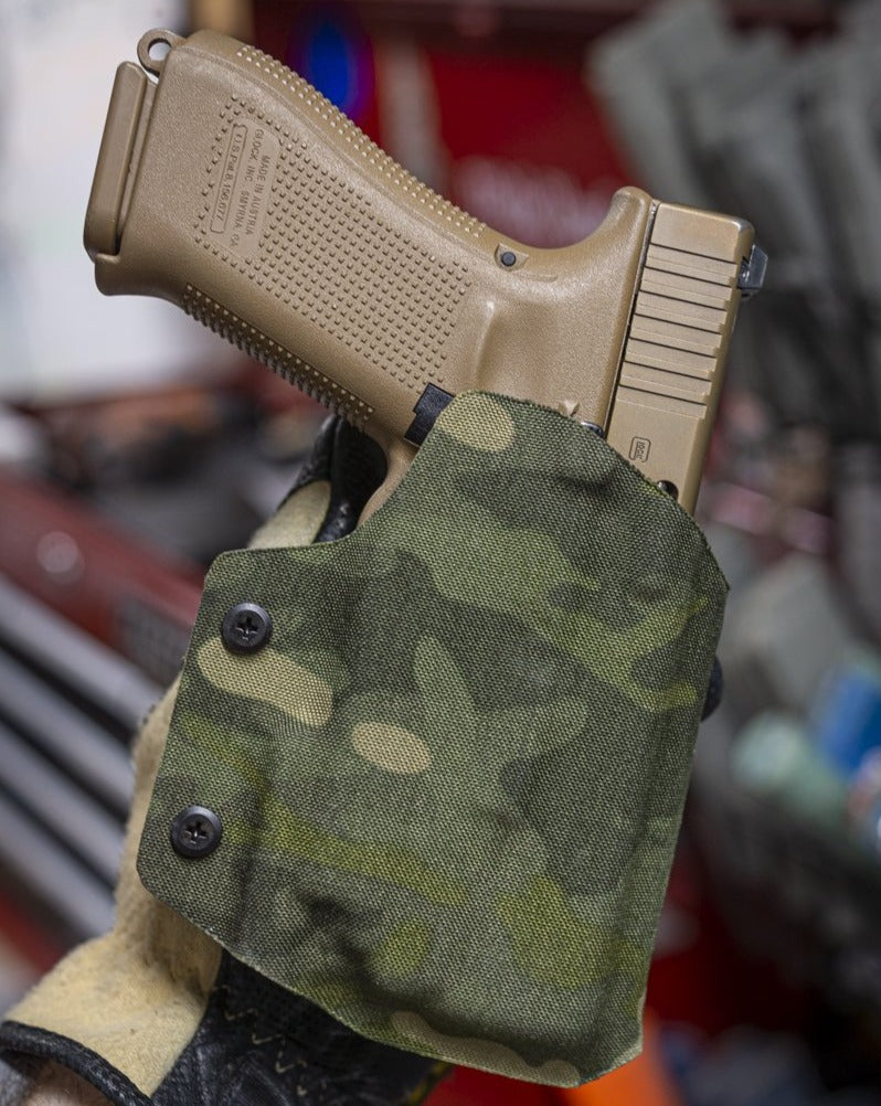 OWB Fold Over light bearing Kydex holster in Multicam Tropic for a Glock 17 with Olight PL-Mini 2.