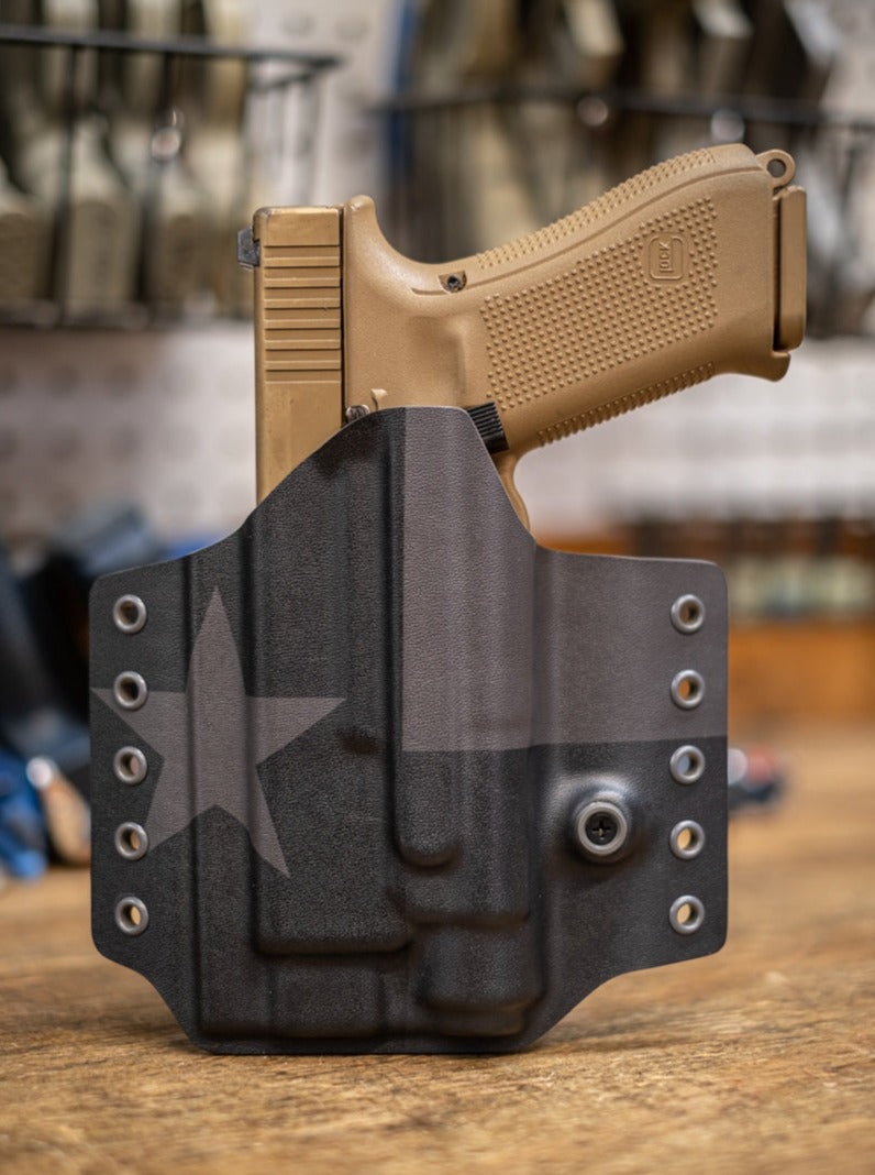 Black on Black Texas flog Outside the Waistband Kydex holster for a Glock 19 with Streamlight TLR-1 Light.